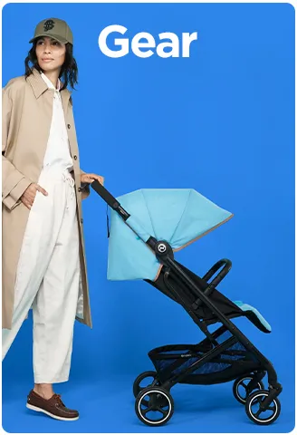 Woman pushing a modern baby stroller with a turquoise canopy against a blue background