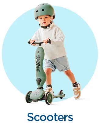 Toddler on a mint green scooter with three wheels and helmet.